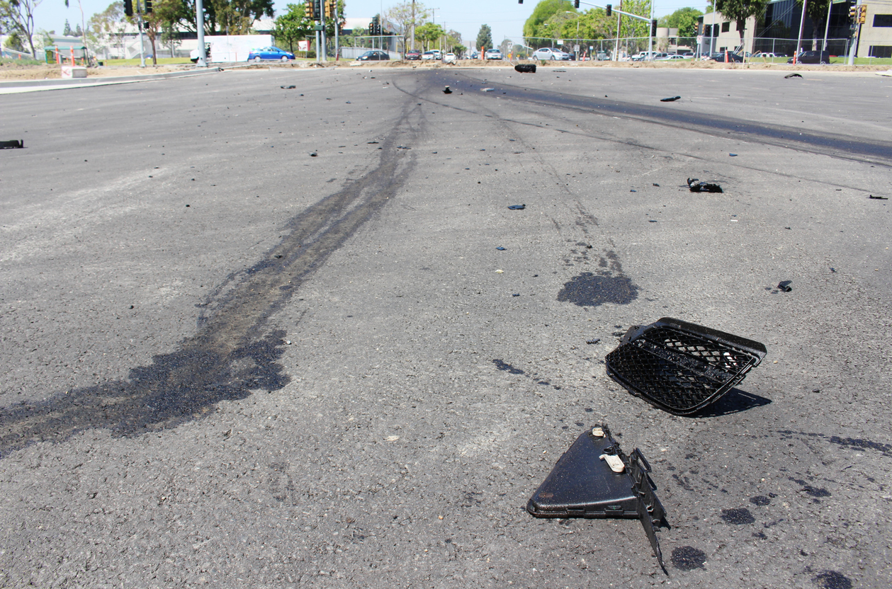 Skid marks left behind with damage from a hit and run car accident