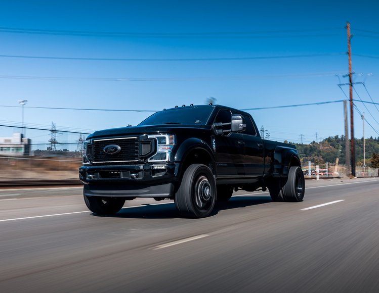 What risks do supersized vehicles pose on the road