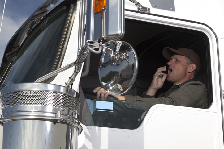 truck driver yawning while driving - Truck driver fatigue accident lawyer
